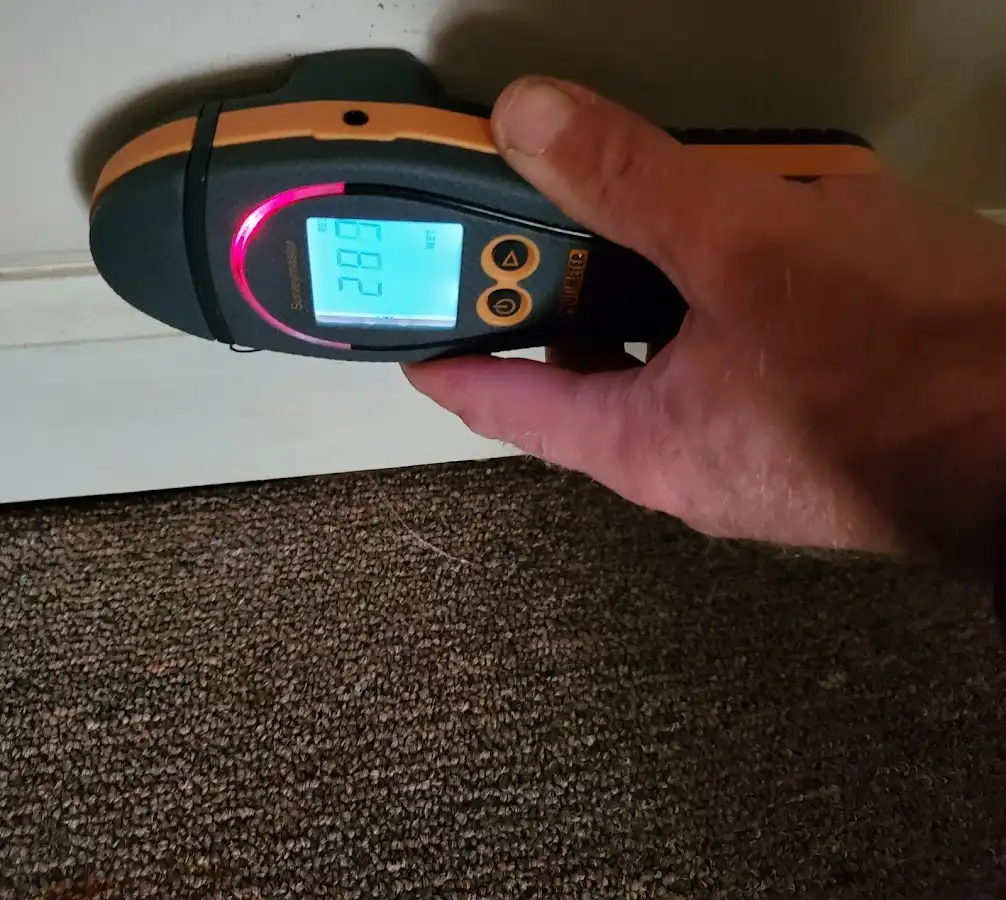 Moisture detection at baseboard during Storm Damage Restoration in Lamesa